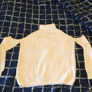 Turtleneck sweater with cut out shoulders